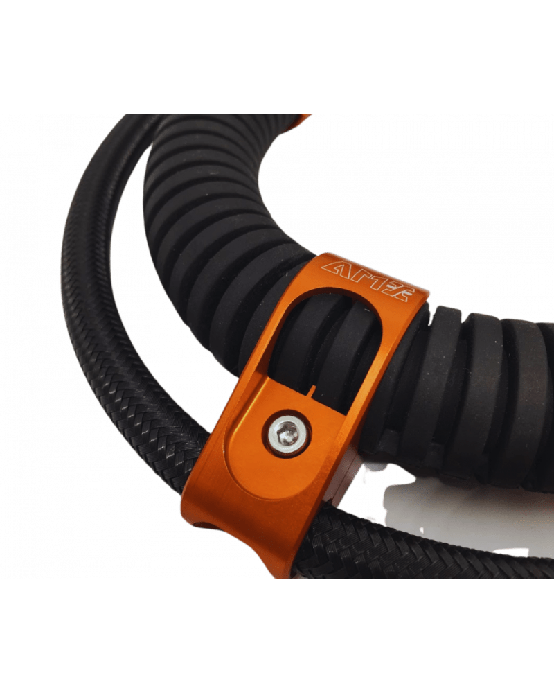 Orange bracket securing black hose
