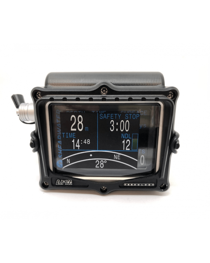 Black dive computer displaying time, depth & safety stop.