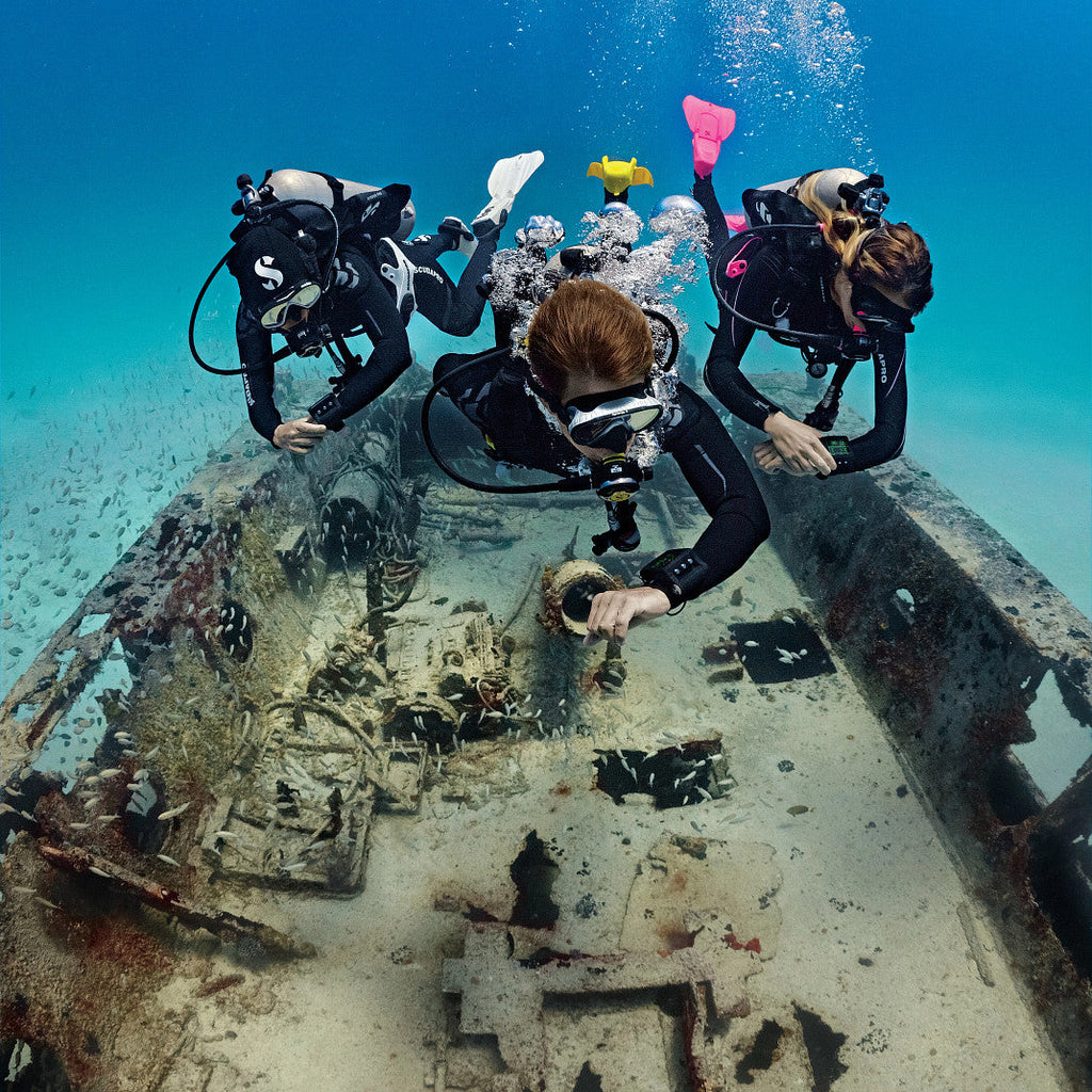 Scuba divers exploring a shipwreck (SP_05080101_G2_6)